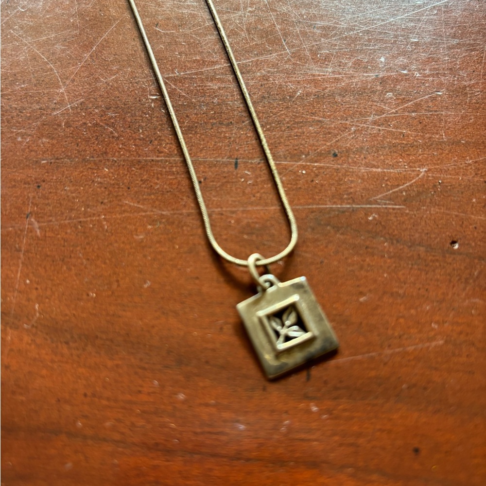 Delicate silver chain with square framed leaf charm